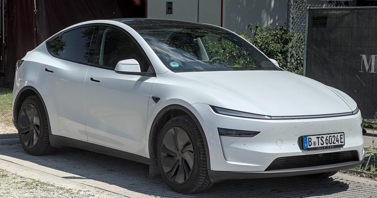 White Tesla Model Y Juniper (2025 refresh) at MYLE Festival showing sleek updated design