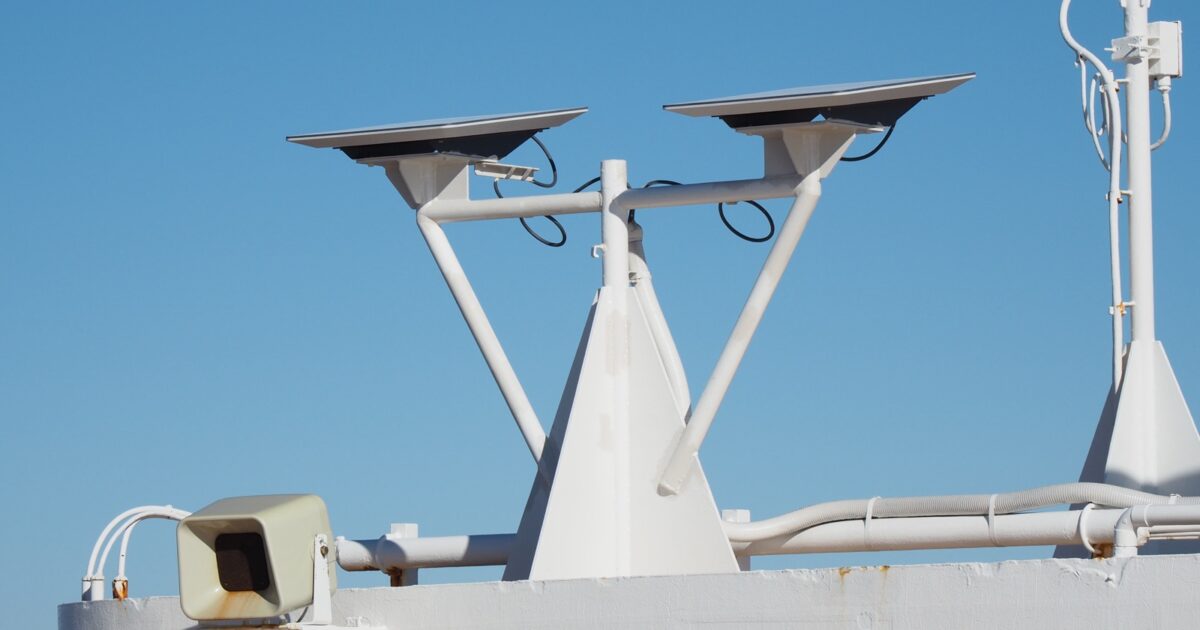 Two Starlink satellite internet terminals mounted on a cruise ship against a blue sky