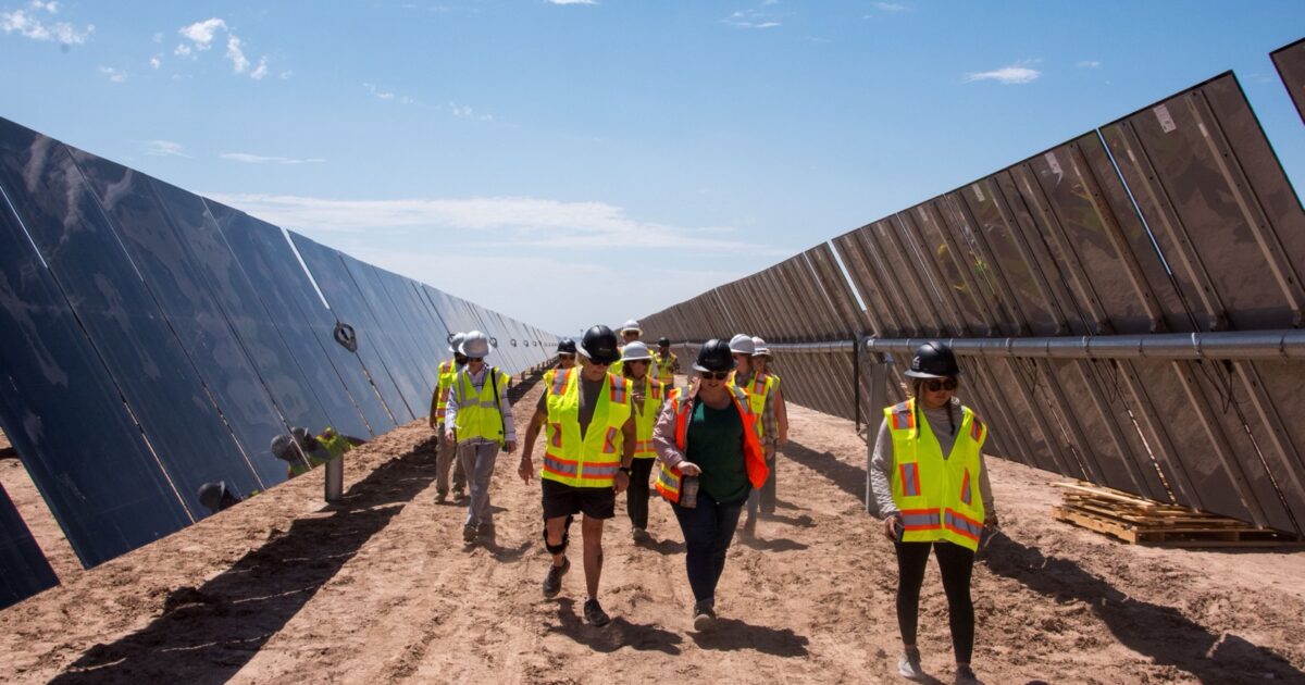 Rows of solar panels at an Arizona utility-scale solar construction site