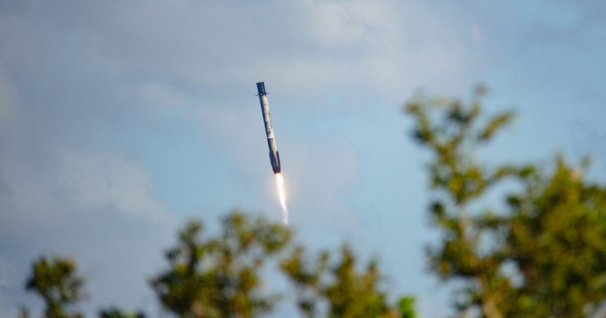 Falcon 9 first-stage booster descending toward a Cape Canaveral landing zone