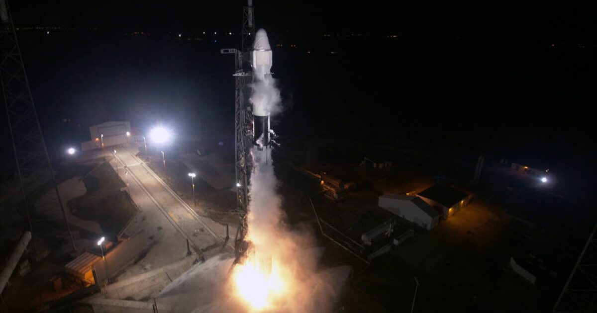 A SpaceX Falcon 9 rocket lifting off at night from Space Launch Complex 40
