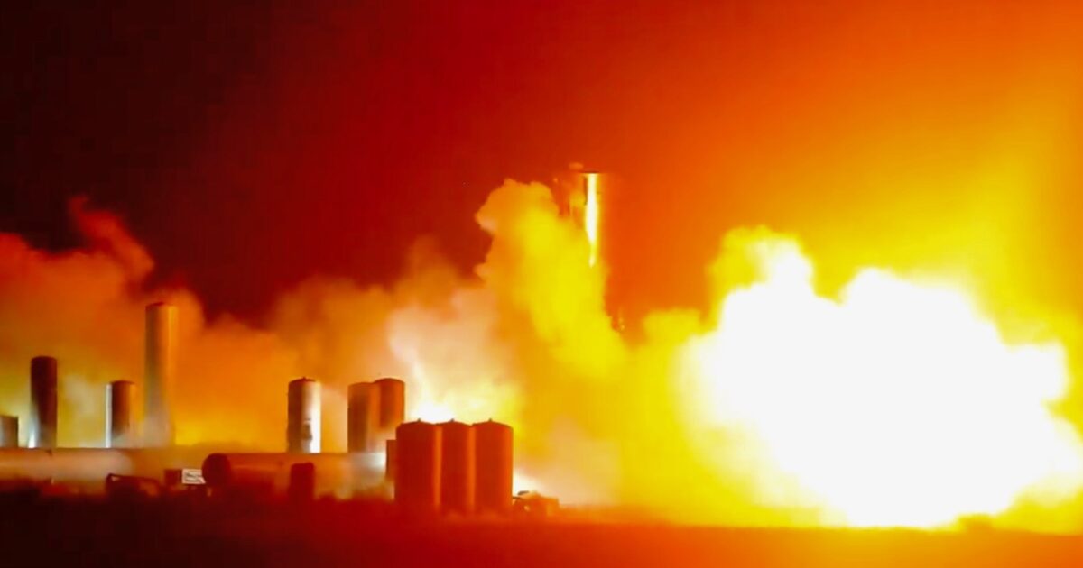 A SpaceX Starship prototype firing a Raptor engine during a nighttime test at Boca Chica