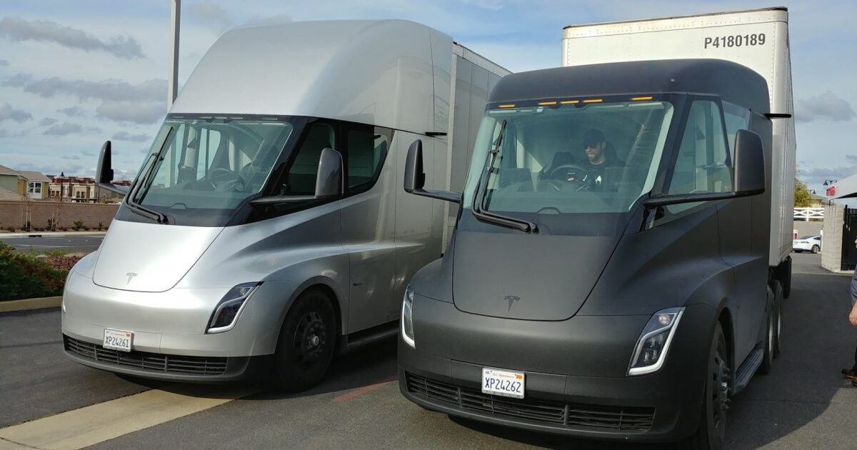 Silver and black Tesla Semi prototypes parked together in Rocklin, California