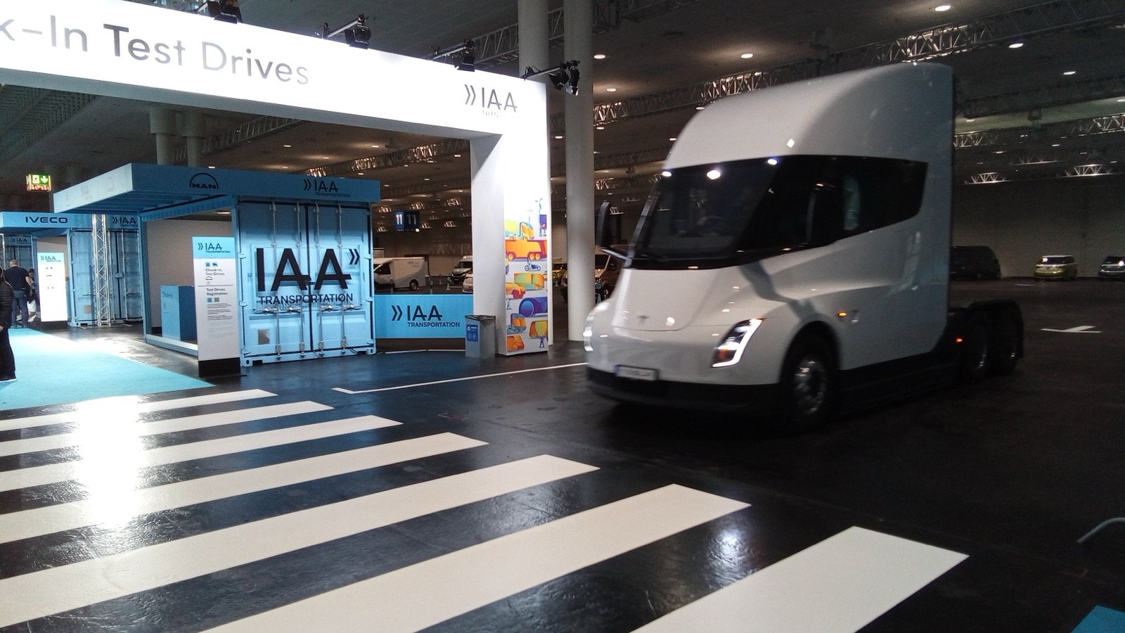 Tesla Opens New Semi Factory With 11 Customer-Branded Trucks Lined Up Outside