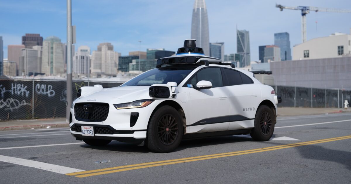 Waymo Jaguar I-Pace autonomous vehicle driving on a San Francisco street