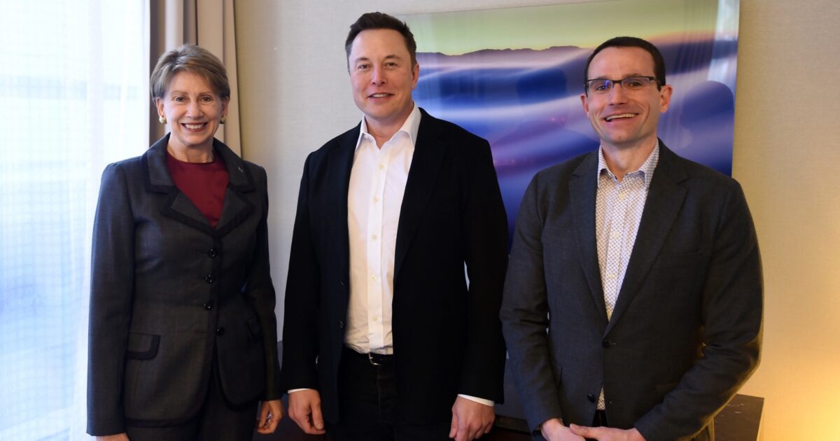 Elon Musk standing with Air Force technology leaders at Space Pitch Day