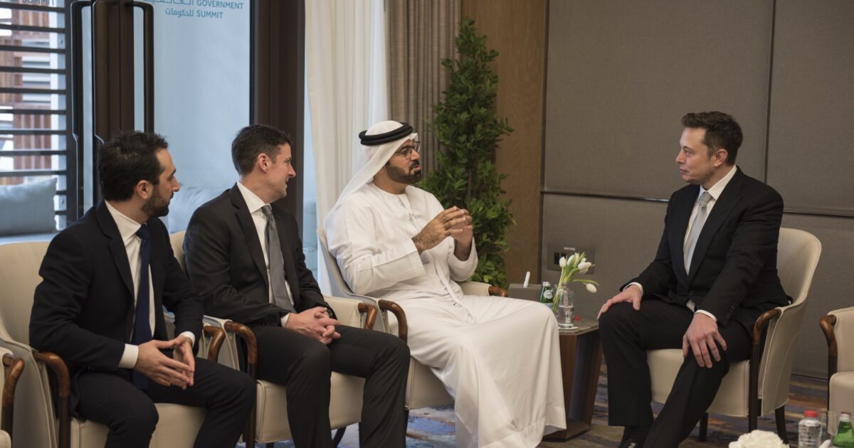 Elon Musk listens during a government-policy discussion at the World Government Summit