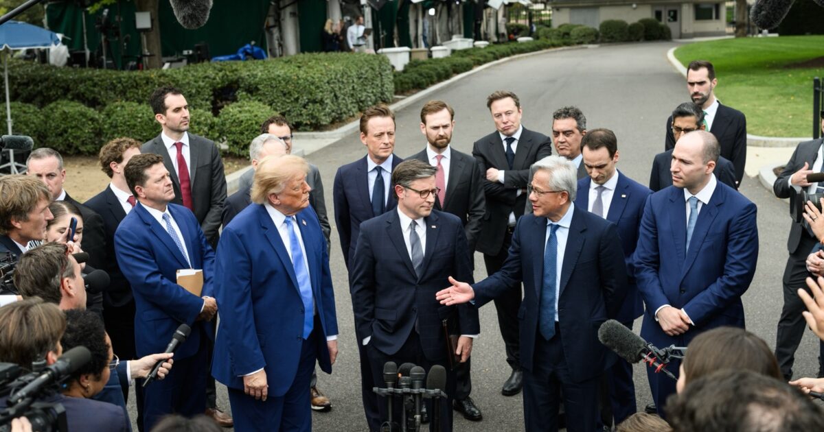 Elon Musk stands behind President Trump and technology executives outside the White House