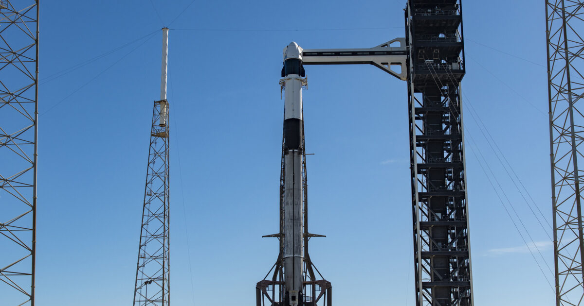 SpaceX Falcon 9 and Dragon standing on the launch pad at SLC-40