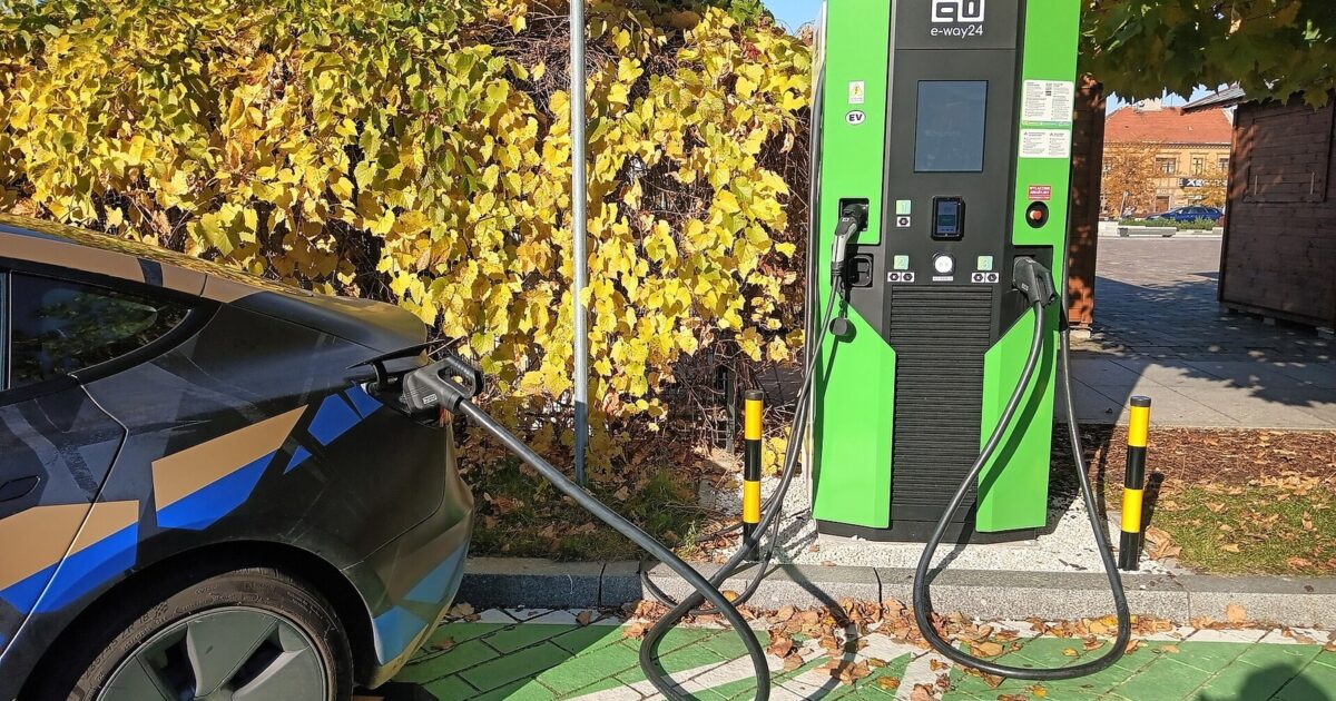 Tesla Model 3 connected to an electric vehicle charging station